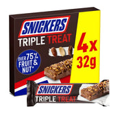 A box of Snickers - Triple Treat Fruit Nut & Chocolate Bars - 4 Pack with "4 x 32g" highlighted and "Over 75% fruit & nut." One unwrapped date raisin peanut bar and a wrapped bar are shown—made with milk chocolate, high in fibre.